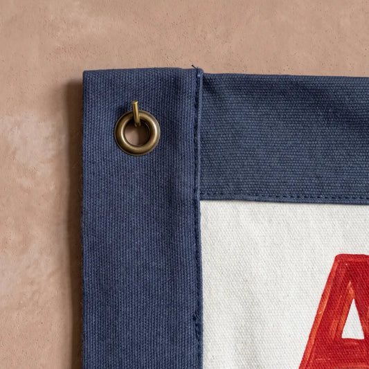 Gotta Act Right banner flag hung in a room