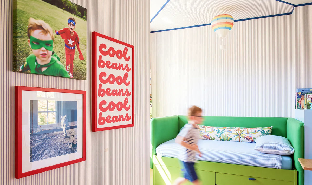 Bold framed artwork and family photos in a kid’s room