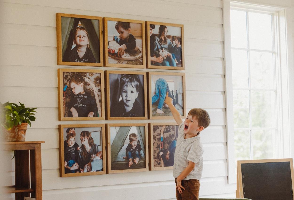 A coordinated gallery wall made from family photos